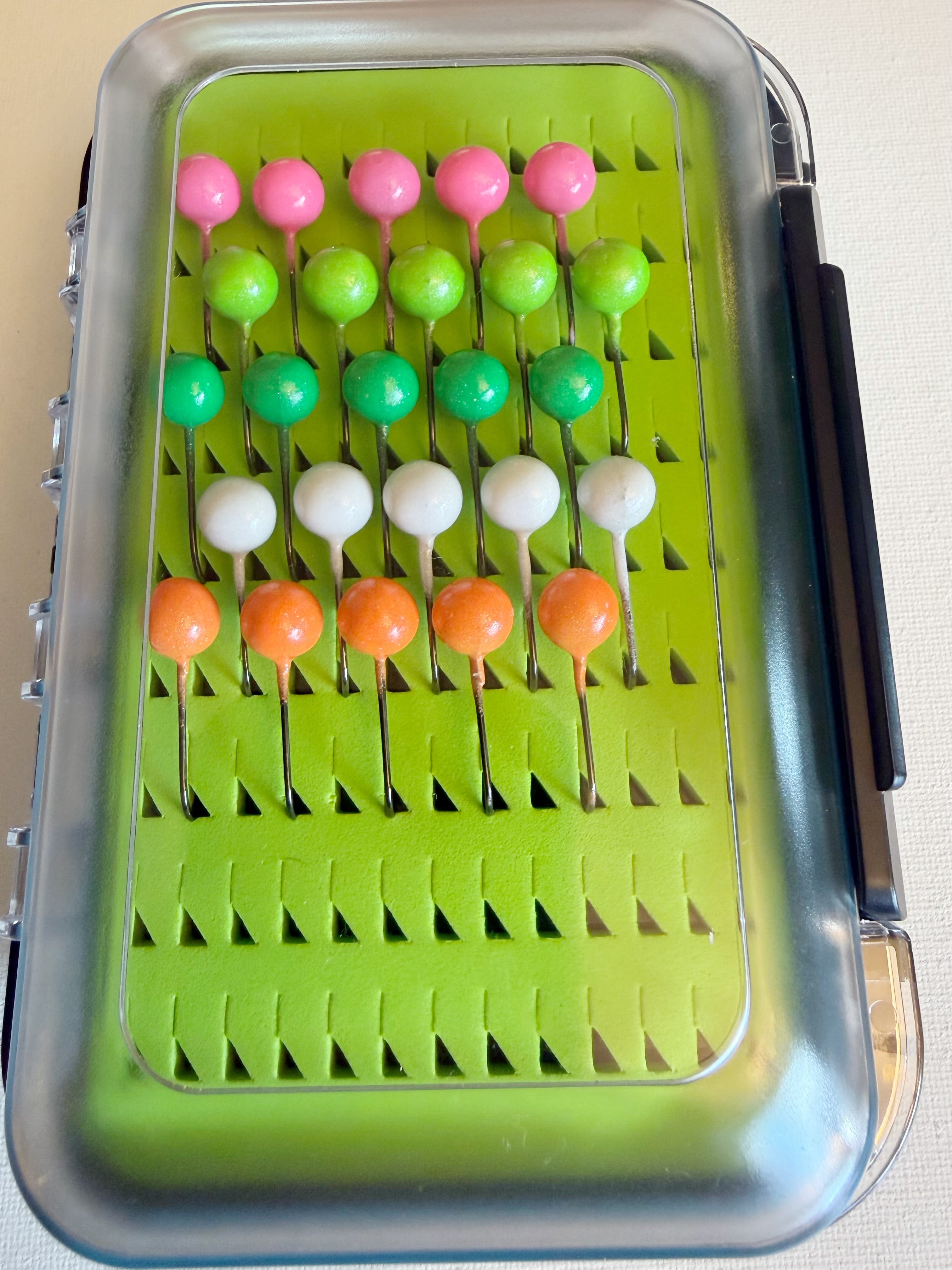 GEM Jigs walleye box showing twenty five handcrafted 1/8 oz jigs in waterproof case. 
