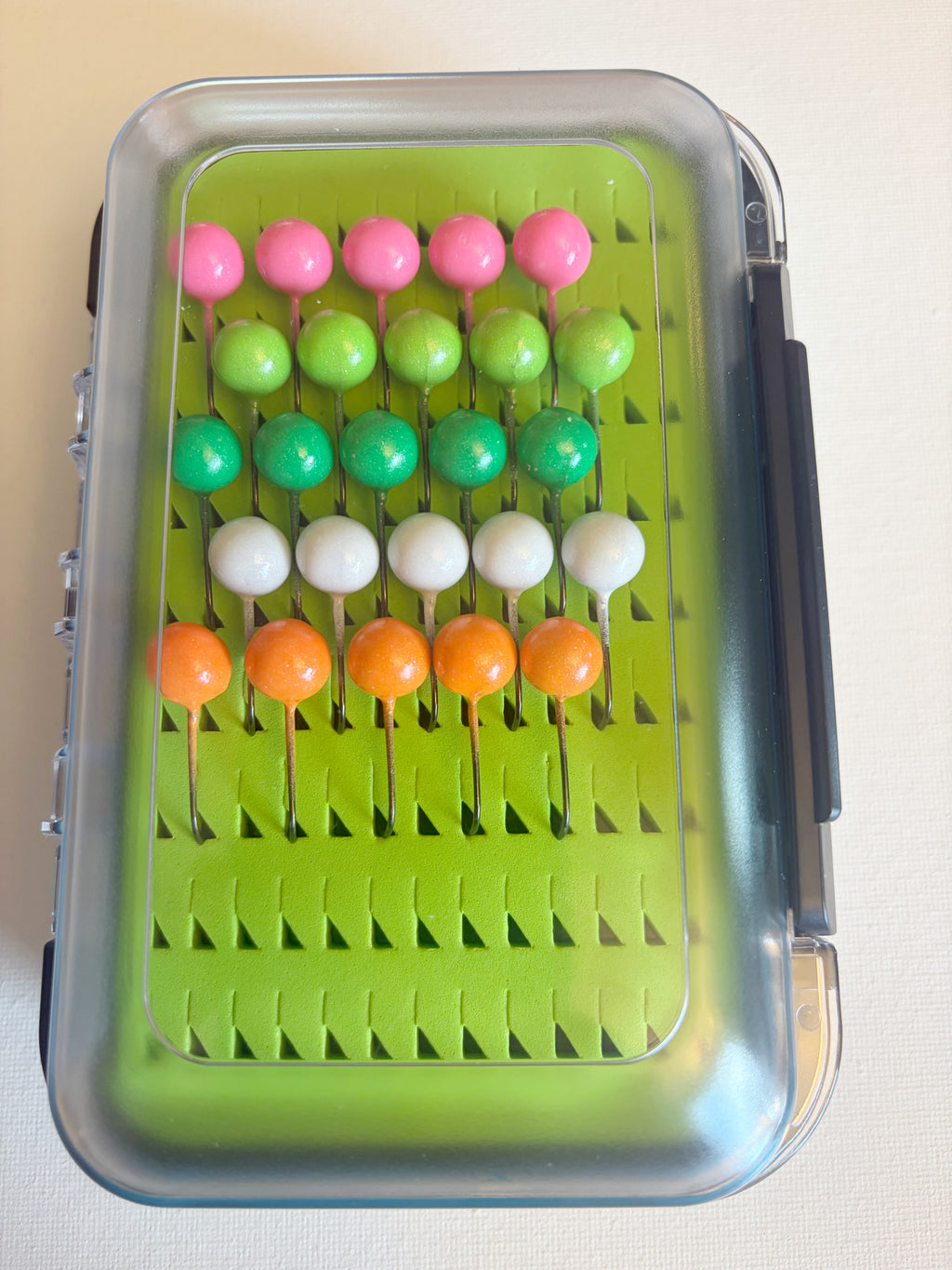 GEM Jigs box loaded with twenty five handcrafted 3/16 oz walleye fishing jigs from GEM Floats