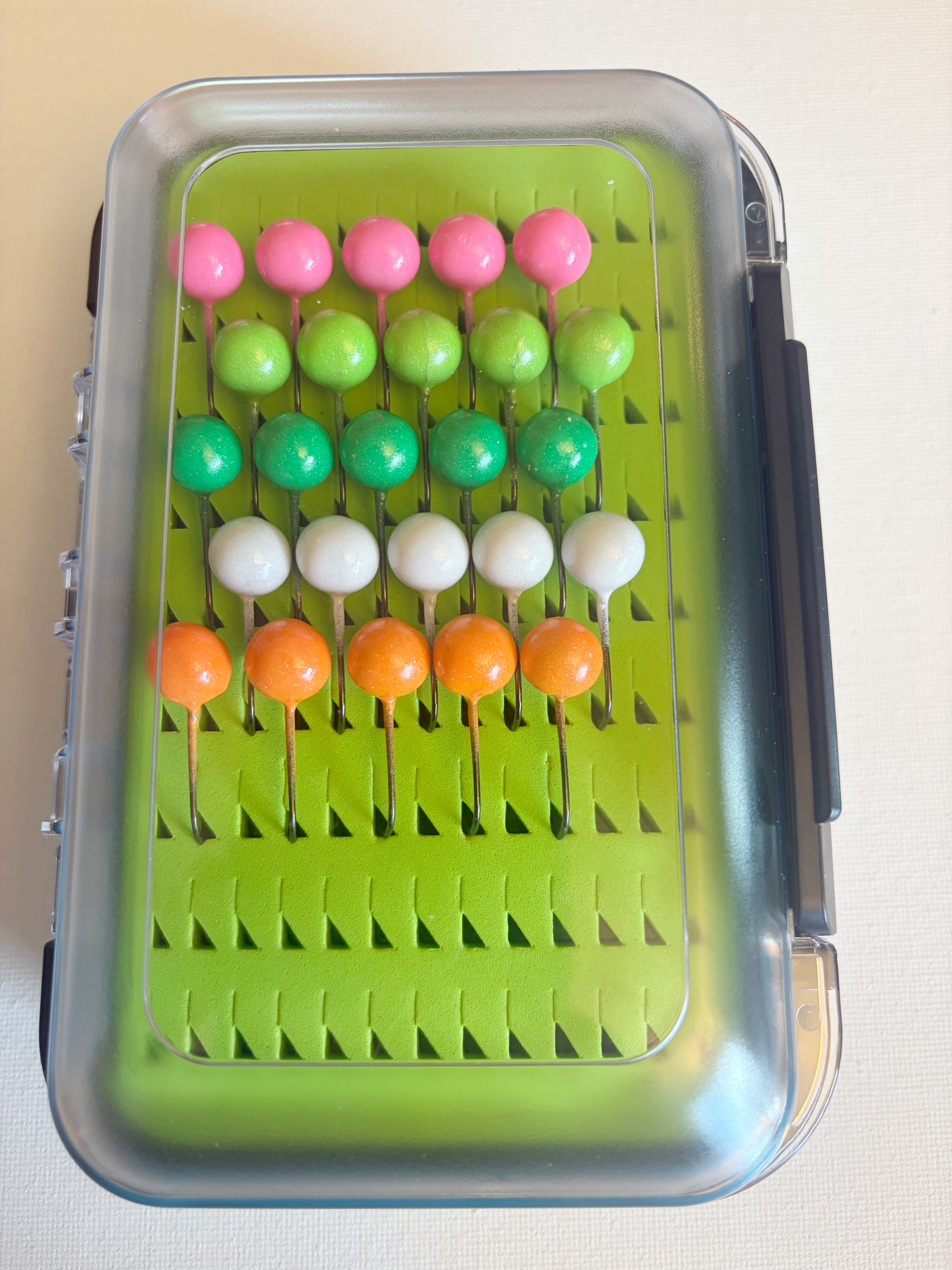 GEM Jigs box loaded with twenty five handcrafted 3/16 oz walleye fishing jigs from GEM Floats