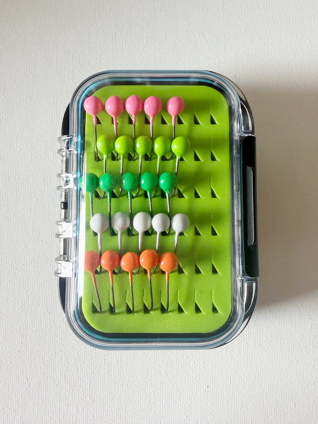 GEM Jigs box showing twenty five handcrafted 1/16oz panfish jigs.