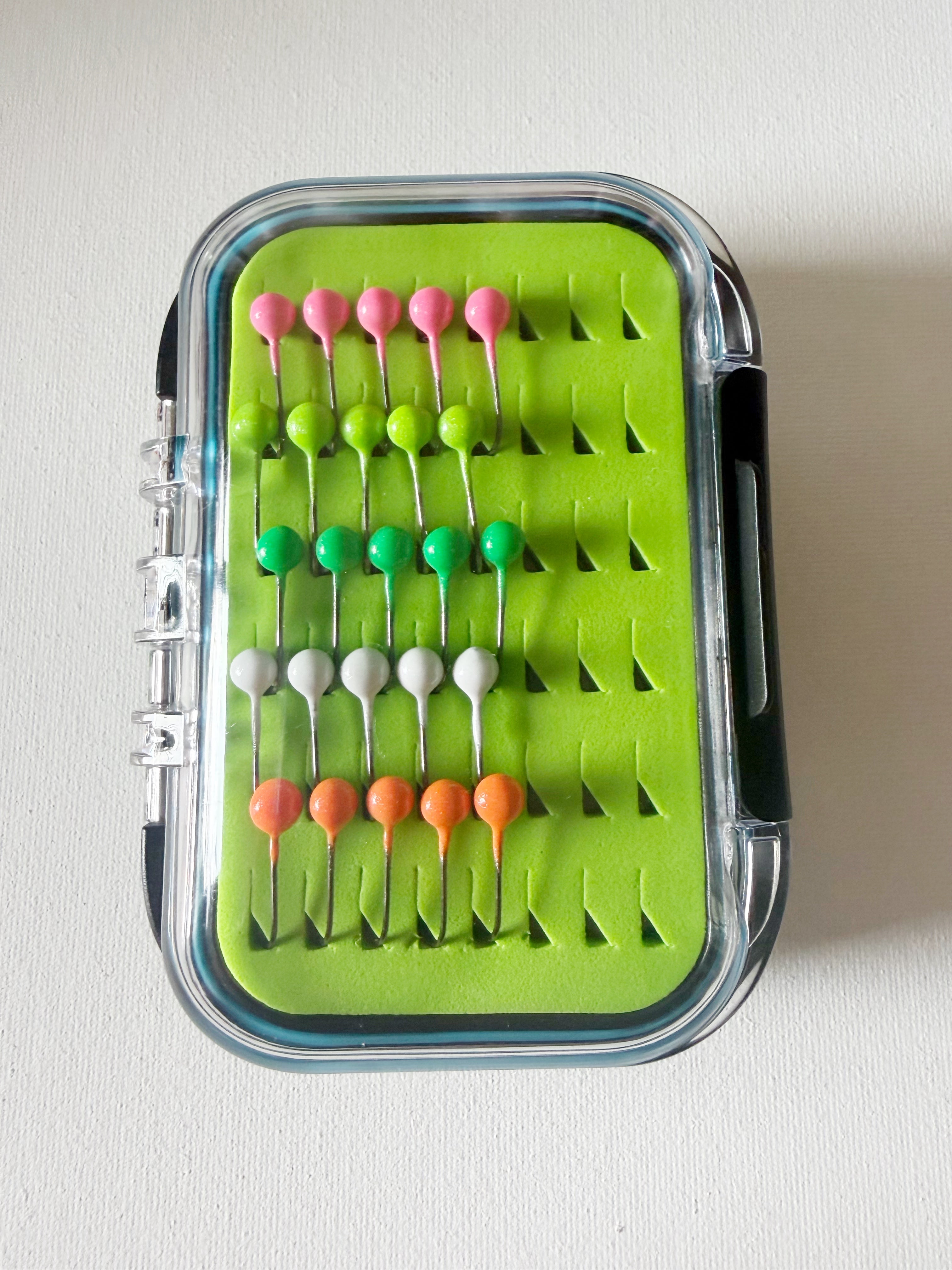 Gem Jigs box loaded with twenty five handcrafted 1/32 oz panfish fishing jigs.